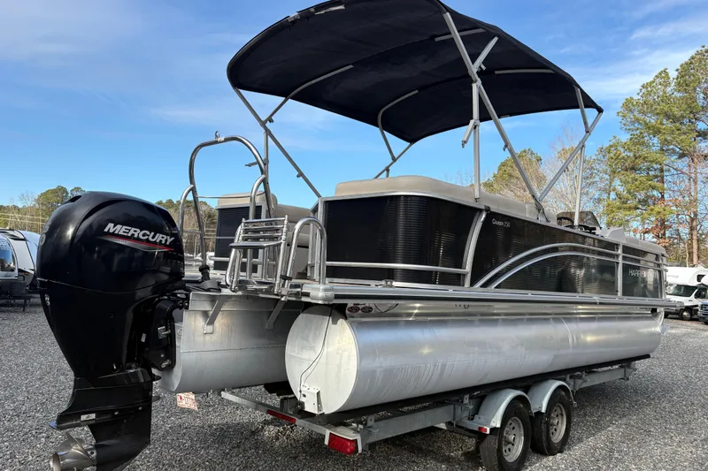Slide: The Image of 2020 Harris Cruiser 250 pontoon boat with Mercury outboard engine on trailer. - 23