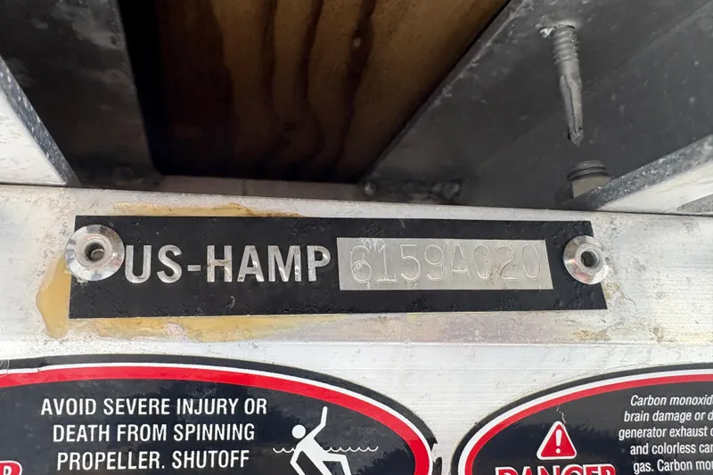 Slide: The Image of 2020 Harris Cruiser 250 identification plate with safety warning labels. - 35