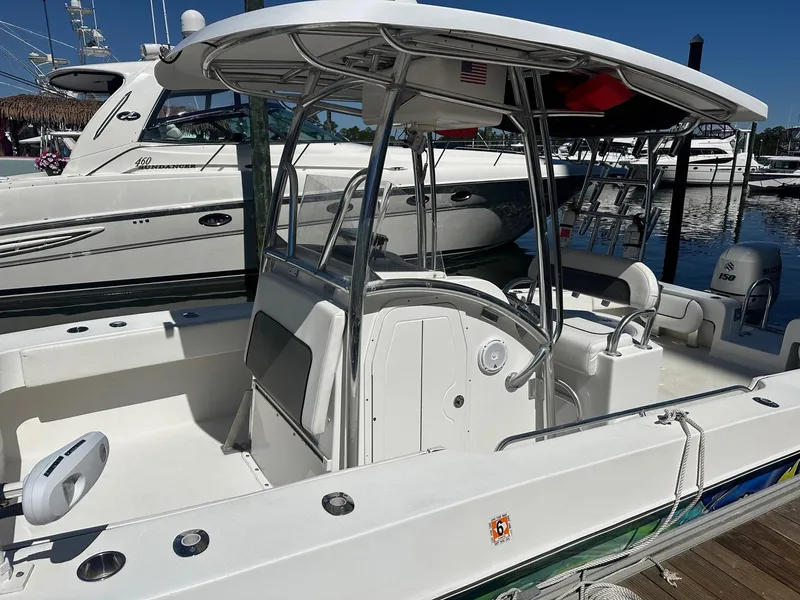 Slide: The Image of 2017 Twin Vee 26 GF boat docked, featuring a sleek design and spacious deck. - 5