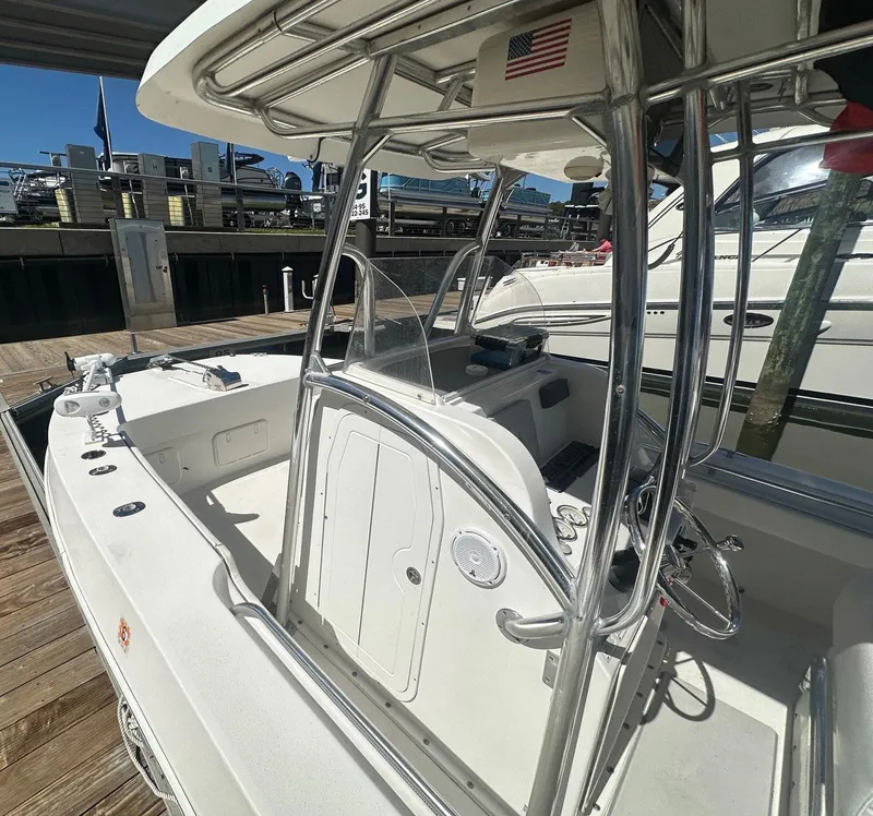 Slide: The Image of 2017 Twin Vee 26 GF boat at dock, featuring sleek design and sturdy framework. - 7