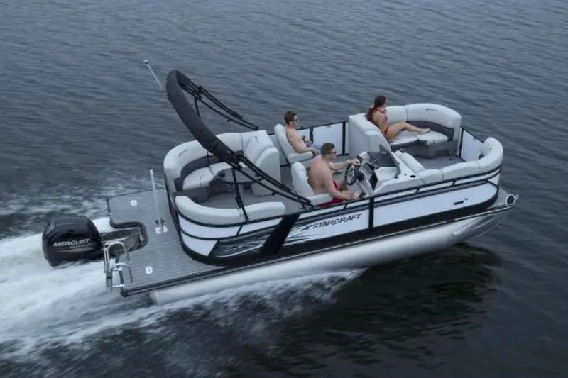 Slide: The Image of 2024 Starcraft SLS 1 pontoon boat cruising on water with passengers. - 10