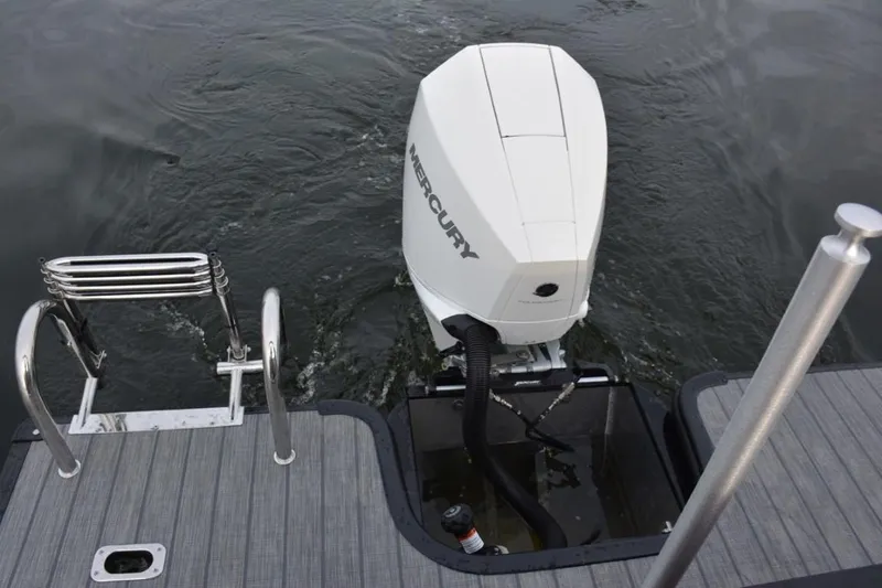 Slide: The Image of 2023 Starcraft SLS 1 boat with Mercury outboard motor on water. - 18