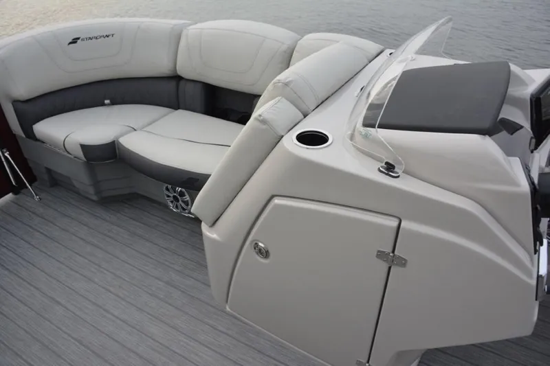 Slide: The Image of 2024 Starcraft SLS 3 boat interior with cushioned seating and control console. - 5