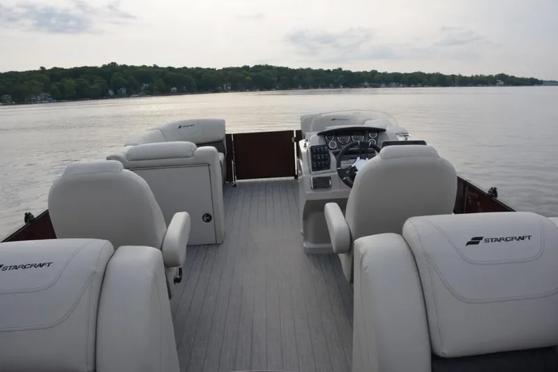 Slide: The Image of 2024 Starcraft SLS 3 pontoon boat interior with lake view. - 8