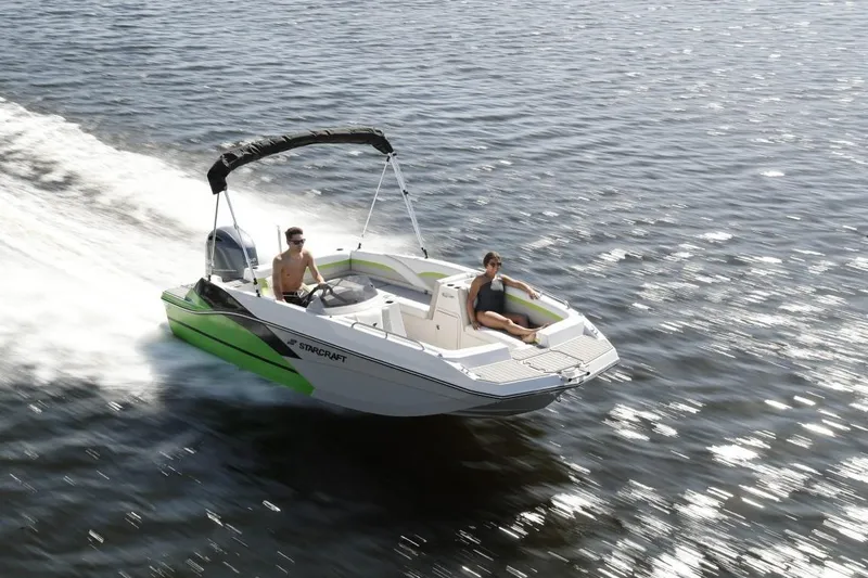 Slide: The Image of 2024 Starcraft 191 SVX boat cruising on water with two passengers. - 6