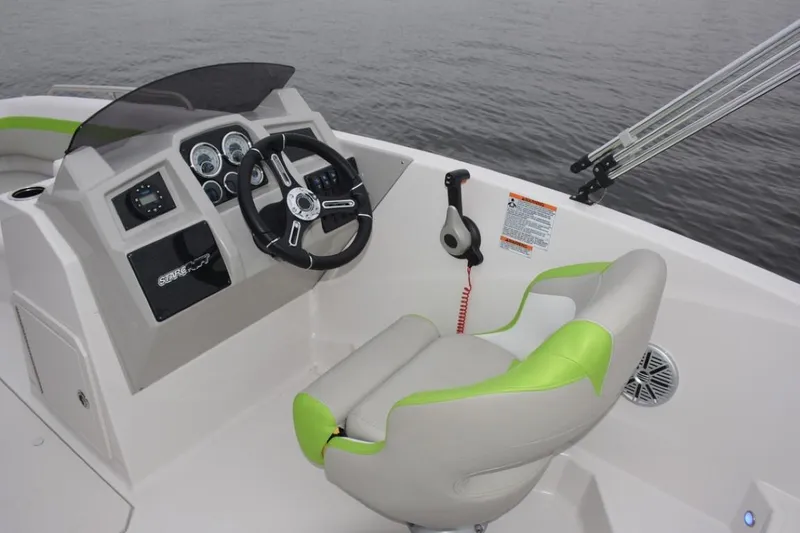 Slide: The Image of 2023 Starcraft 191 SVX boat cockpit with steering wheel and control panel. - 7
