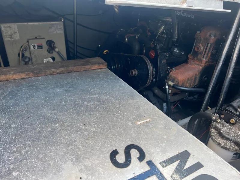 Slide: The Image of Engine compartment of a 1996 Silverton 310 Express boat, showing mechanical components. - 19