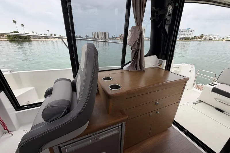 Slide: The Image of Interior of 2019 Jeanneau NC 895 boat with seating and water view. - 13