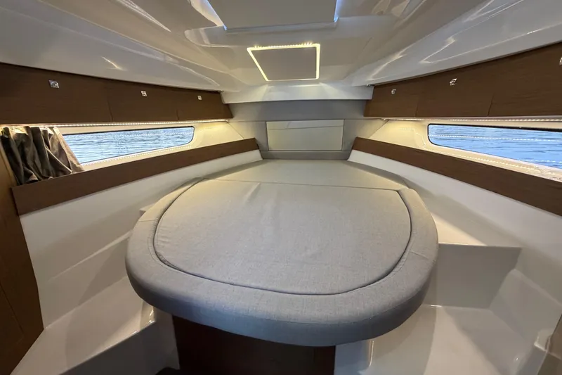 Slide: The Image of 2019 Jeanneau NC 895 cabin interior with modern design and comfortable seating. - 17
