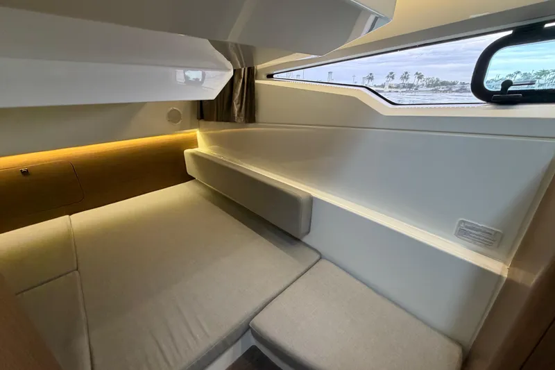 Slide: The Image of 2019 Jeanneau NC 895 cabin interior with modern design and comfortable seating. - 19