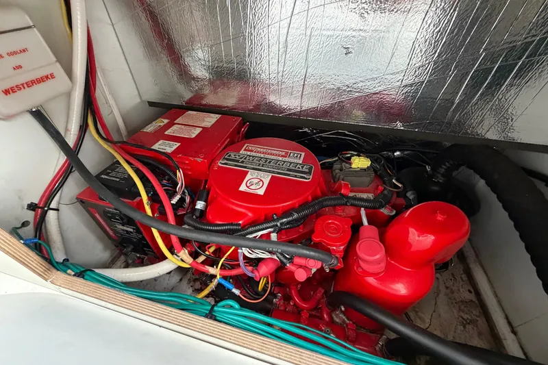 Slide: The Image of Engine compartment of 2019 Jeanneau NC 895 with Westerbeke generator and wiring. - 22