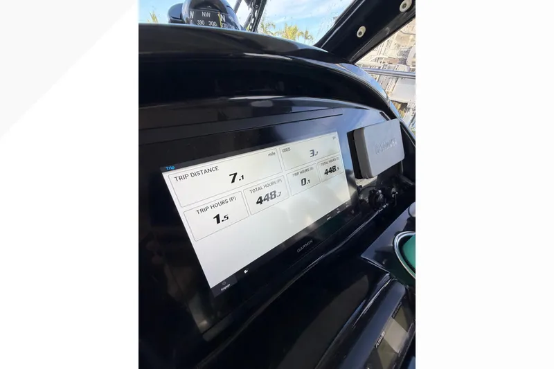 Slide: The Image of Dashboard of 2019 Jeanneau NC 895 boat showing trip data on Garmin display. - 26