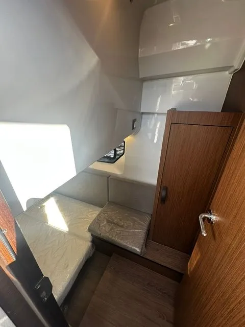 Slide: The Image of Interior of 2026 Beneteau Antares 11 Coupe with cozy cabin. - 11