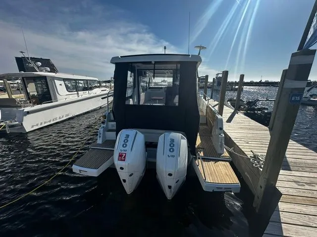 Slide: The Image of Beneteau Antares 11 Coupe 2026 with twin outboard engines at dock. - 20