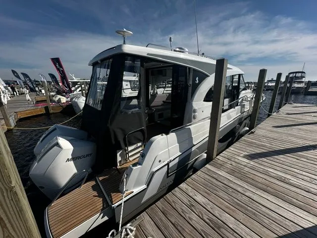 Slide: The Image of Beneteau Antares 11 Coupe 2026 docked under sunny skies. - 22