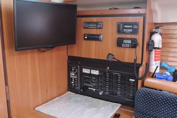 Slide: The Image of Control panel of a 2008 Catalina 350 MkII sailboat with navigation equipment. - 14