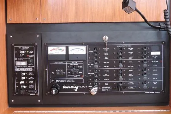 Slide: The Image of Electrical control panel of a 2008 Catalina 350 MkII yacht with various switches and gauges. - 17