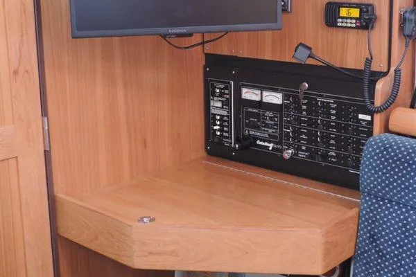 Slide: The Image of Navigation station in 2008 Catalina 350 MkII sailboat with control panel and seating. - 18