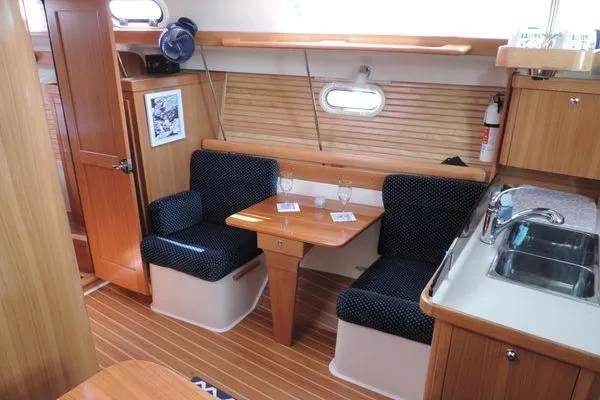 Slide: The Image of Interior of 2008 Catalina 350 MkII sailboat with dining area and kitchenette. - 20