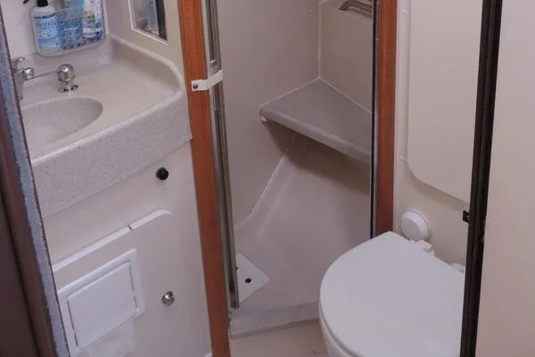 Slide: The Image of 2008 Catalina 350 MkII bathroom with sink, toilet, and shower area. - 28
