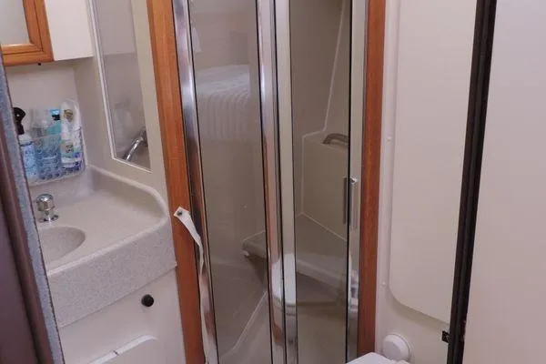 Slide: The Image of 2008 Catalina 350 MkII yacht bathroom with shower, sink, and mirror. - 29