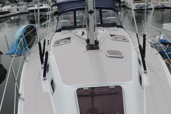 Slide: The Image of 2008 Catalina 350 MkII sailboat docked at marina, showcasing deck and hatches. - 4