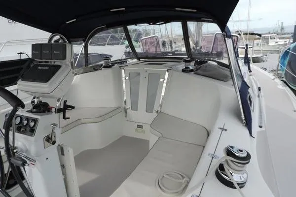 Slide: The Image of 2008 Catalina 350 MkII sailboat cockpit with seating and navigation equipment. - 6