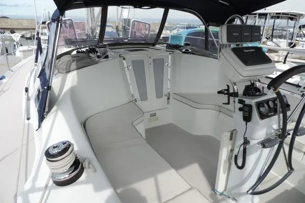 Slide: The Image of 2008 Catalina 350 MkII sailboat cockpit with steering wheel and navigation equipment. - 7