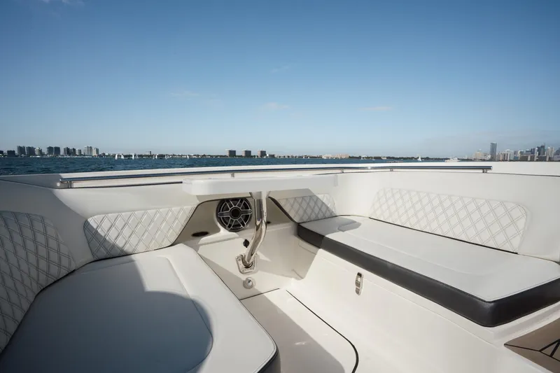 Slide: The Image of 2024 World Cat 400 DC-X boat interior with luxurious seating and ocean view. - 12