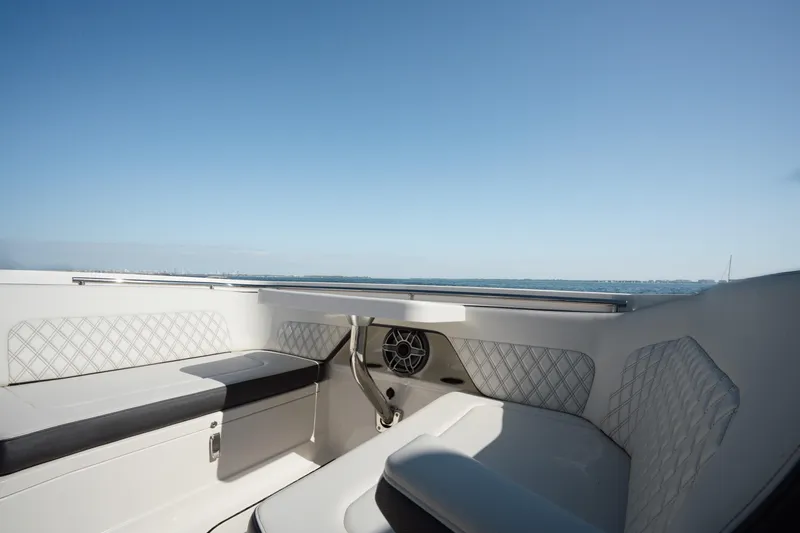 Slide: The Image of 2024 World Cat 400 DC-X boat interior with luxurious seating and ocean view. - 14