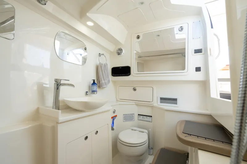 Slide: The Image of Luxurious 2024 World Cat 400 DC-X boat bathroom with modern fixtures and elegant design. - 26