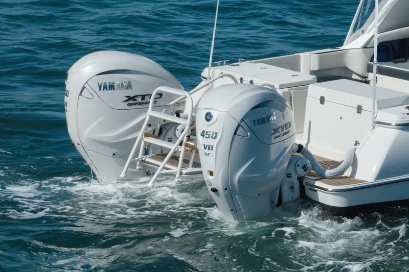Slide: The Image of 2024 World Cat 400 DC-X with dual Yamaha XTO Offshore engines in ocean. - 30