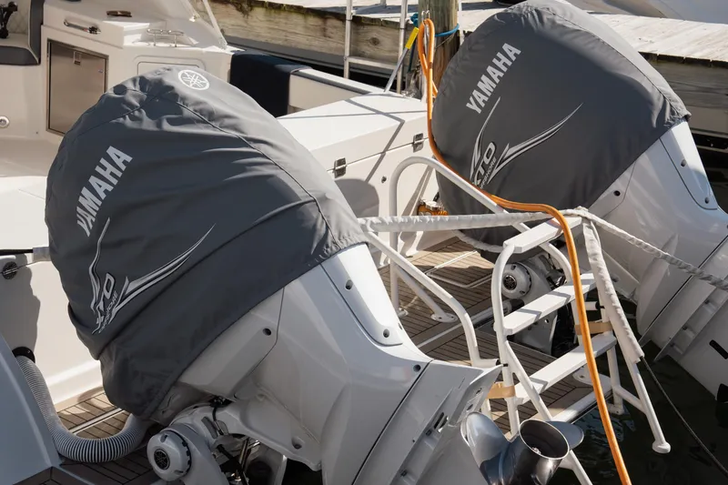 Slide: The Image of 2024 World Cat 400 DC-X boat with Yamaha outboard engines covered at dock. - 31