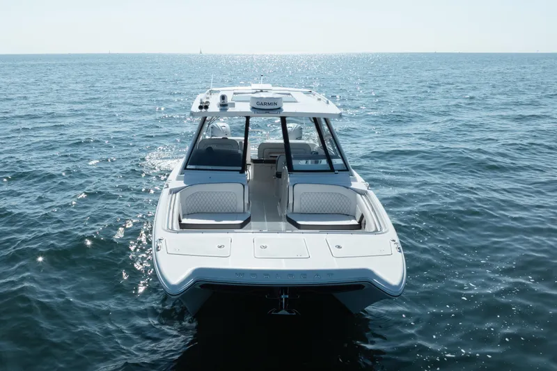 Slide: The Image of 2024 World Cat 400 DC-X boat on open water, showcasing sleek design and luxury features. - 4