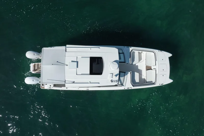 Slide: The Image of Overhead view of 2024 World Cat 400 DC-X boat on clear water. - 8