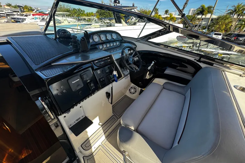 Slide: The Image of Interior of a 2005 Cobolt 36 boat with steering wheel and dashboard controls. - 10