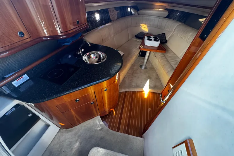 Slide: The Image of Luxurious interior of a 2005 Cobolt 36 yacht with kitchenette and seating area. - 18