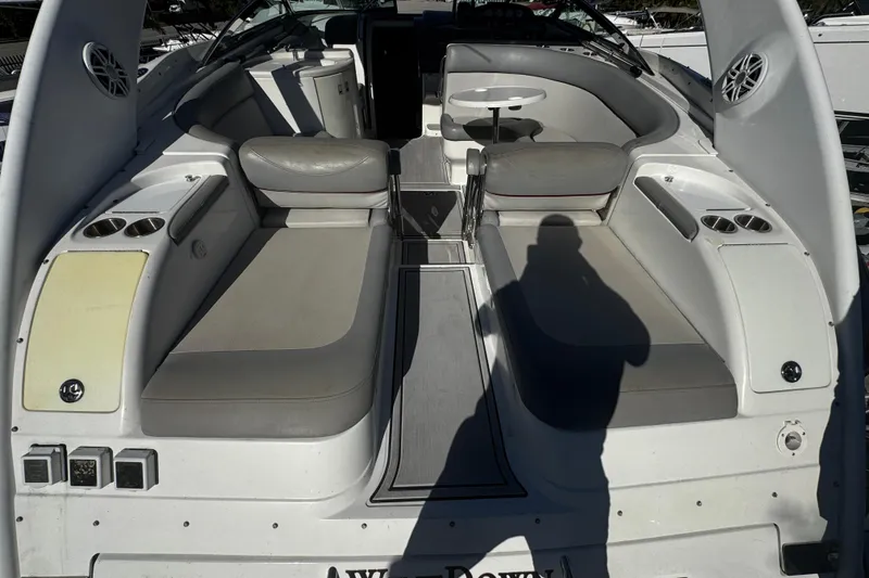 Slide: The Image of Interior of a 2005 Cobolt 36 boat with seating and cup holders. - 2