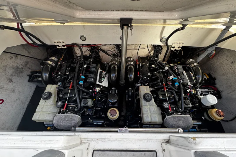 Slide: The Image of Engine compartment of a 2005 Cobolt 36 boat, showcasing dual engines and components. - 31