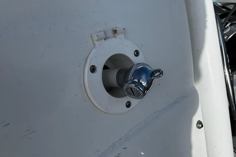 Slide: The Image of Boat water inlet on a 2005 Cobolt 36 model, featuring a chrome cap. - 32