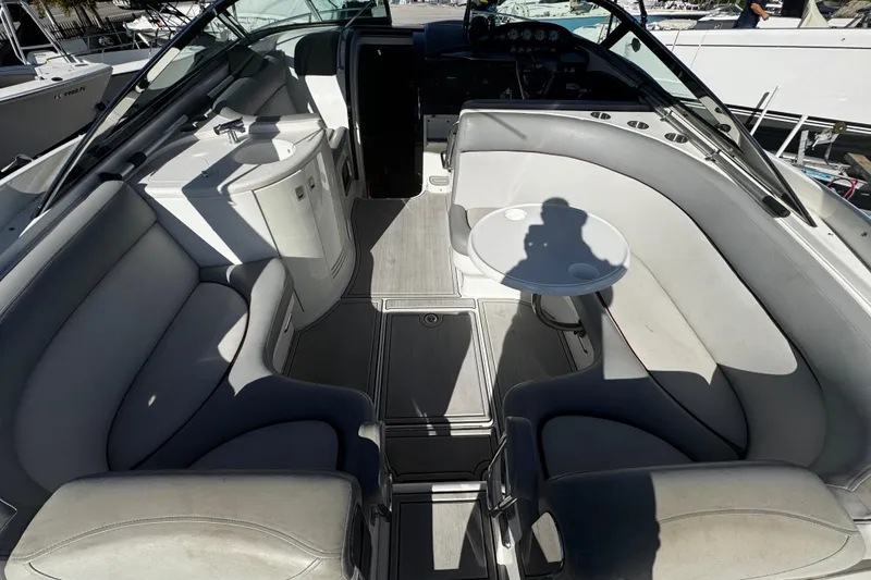 Slide: The Image of Interior of a 2005 Cobolt 36 boat with seating and table. - 5