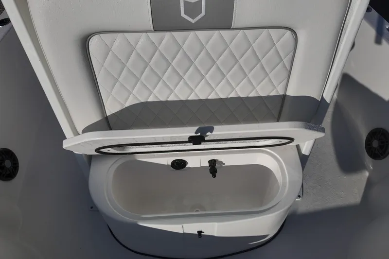Slide: The Image of 2026 Sea Fox 231 Bay Fox boat seat with storage compartment open. - 12