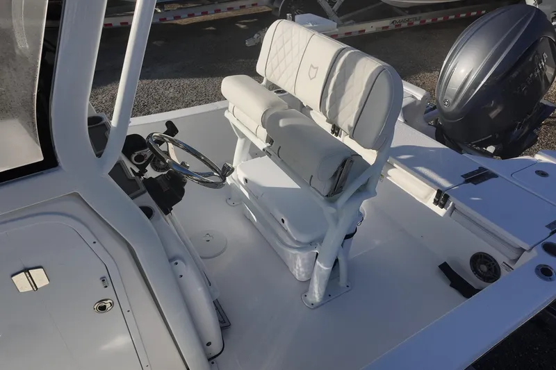 Slide: The Image of 2026 Sea Fox 231 Bay Fox boat interior with steering wheel and seating. - 14