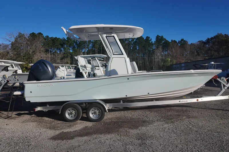 Slide: The Image of 2026 Sea Fox 231 Bay Fox boat on trailer, parked outdoors. - 3