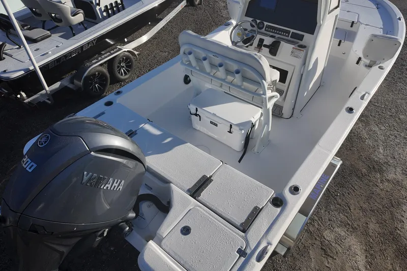 Slide: The Image of 2026 Sea Fox 231 Bay Fox boat with Yamaha engine, featuring spacious deck and modern controls. - 6