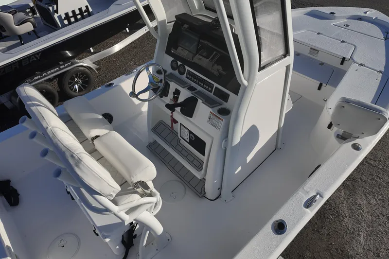 Slide: The Image of 2026 Sea Fox 231 Bay Fox boat interior with steering console and seating. - 7