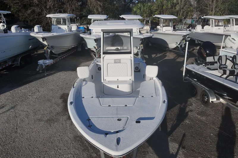 Slide: The Image of 2026 Sea Fox 231 Bay Fox boat displayed among other boats in a marina. - 9