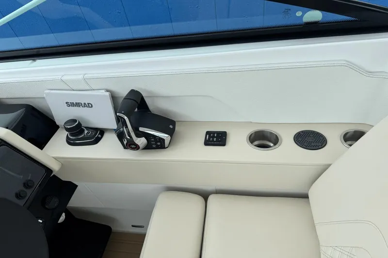 Slide: The Image of Interior of 2026 Cruisers Yachts 34 GLS I/O with Simrad equipment and controls. - 11