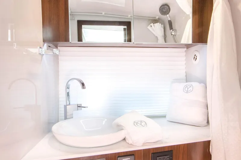 Slide: The Image of Manufacturer Provided Image: Luxurious bathroom interior of 2026 Cruisers Yachts 34 GLS I/O with modern sink and fixtures. - 33