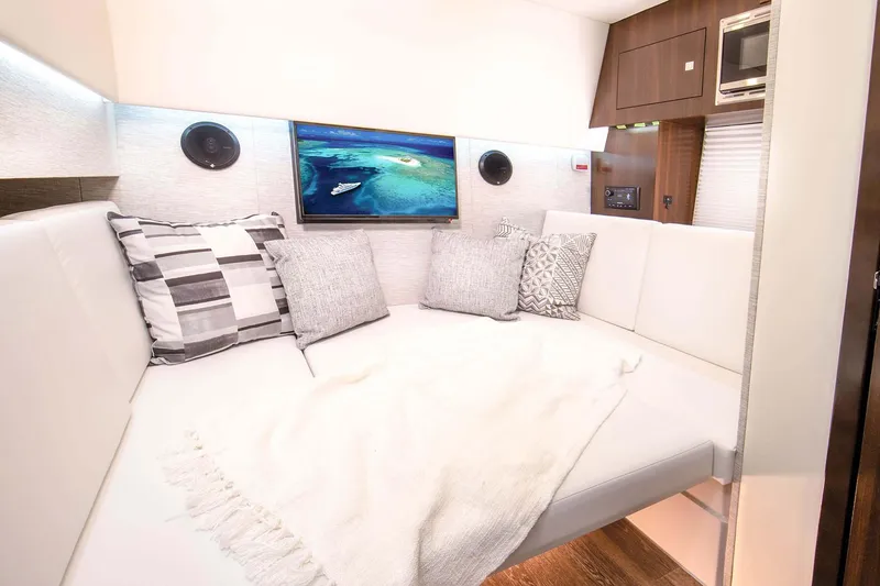 Slide: The Image of Manufacturer Provided Image: Interior of 2026 Cruisers Yachts 34 GLS I/O with cozy seating and modern decor. - 27